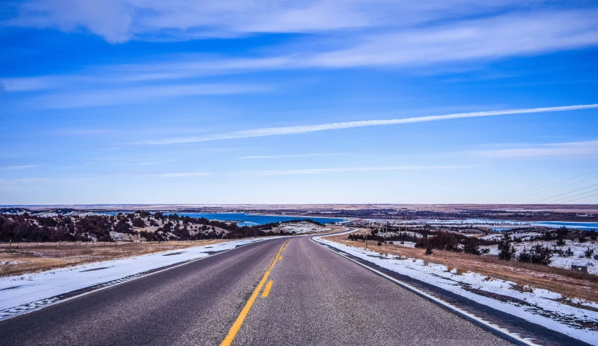 a view of a road from the car driving on it