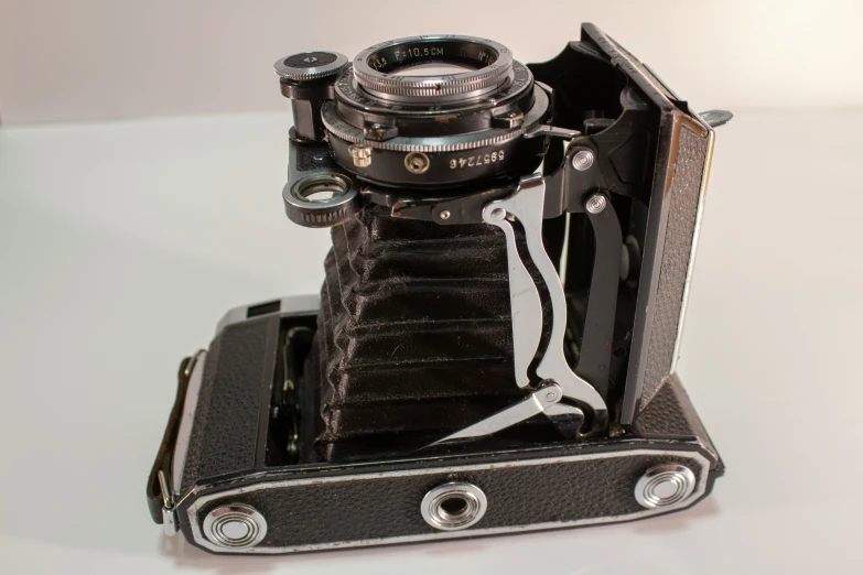 a camera is sitting in its new and still holder