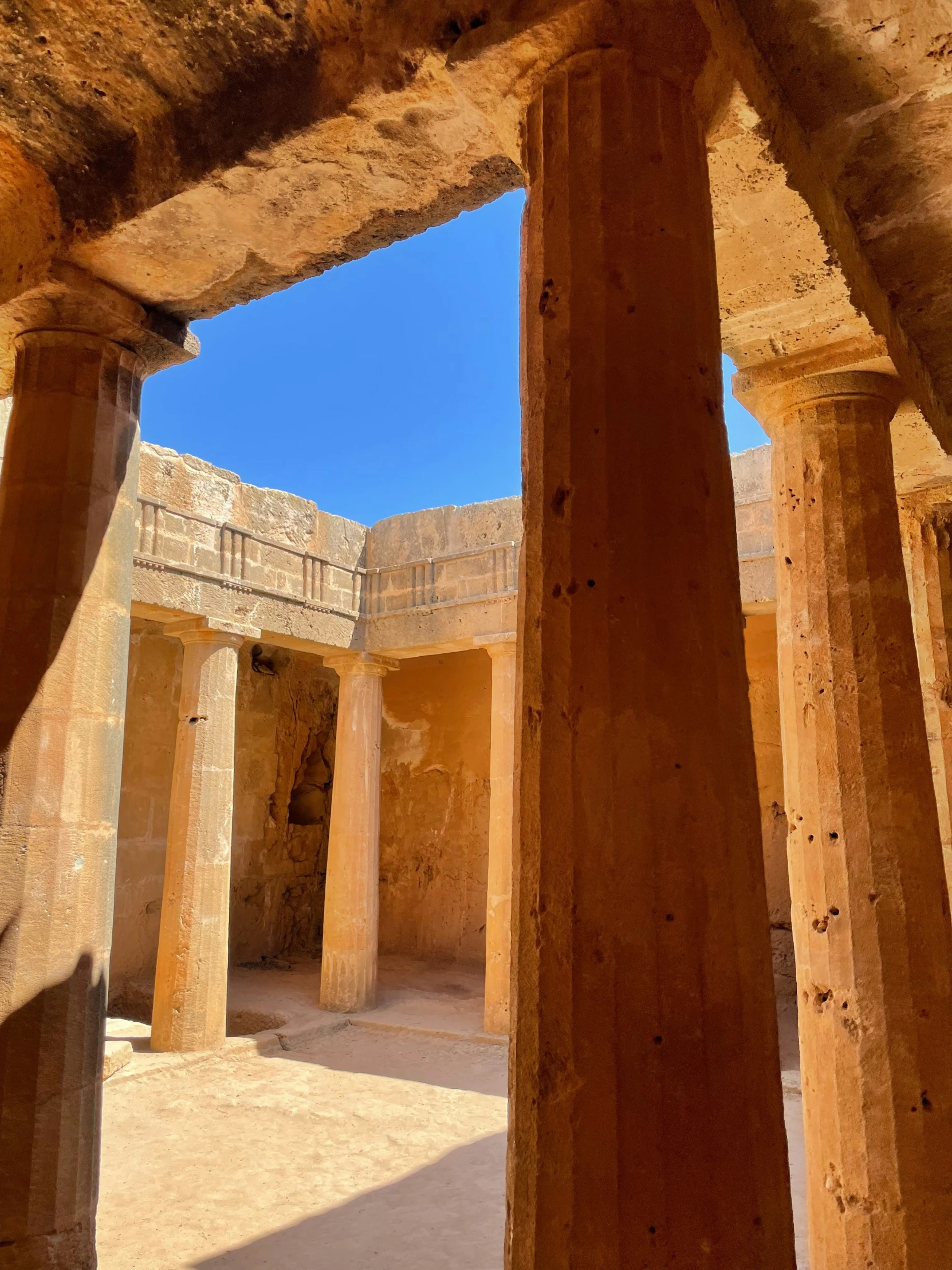 several stone pillars are in an ancient structure