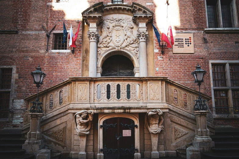 a building has a stone staircase leading up to the entrance