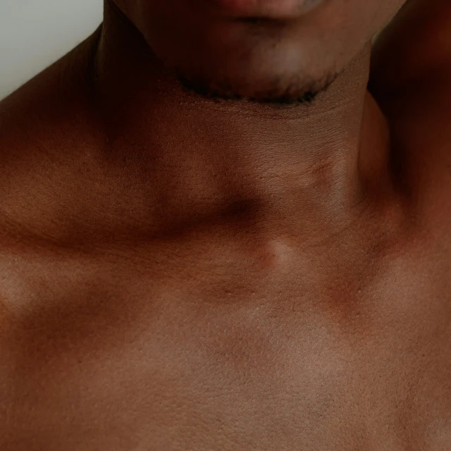 closeup of man's chest showing fine, dark brown hair