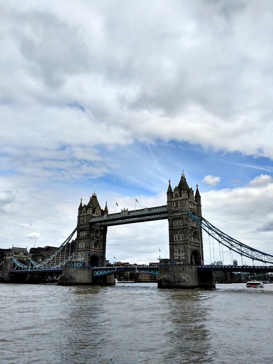 the london tower bridge as seen from a boat on the thames