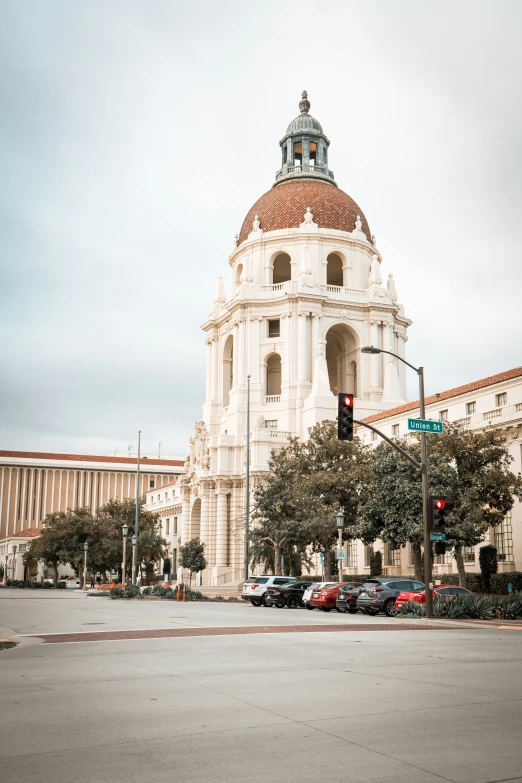 a very large white and red dome next to a street