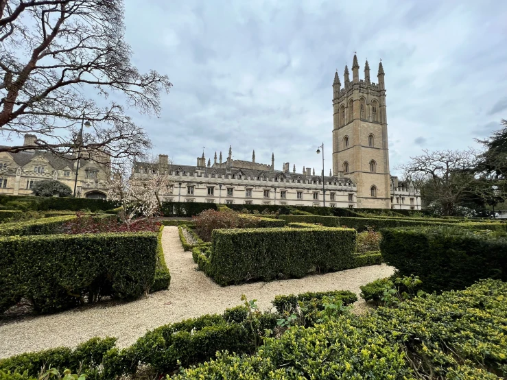 a large castle has a very nice garden