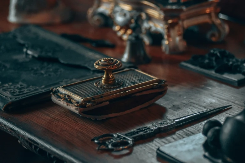 a table with antique keys and antique knick - knacks