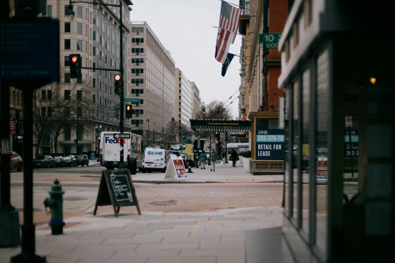 a city street with a traffic light and a sidewalk