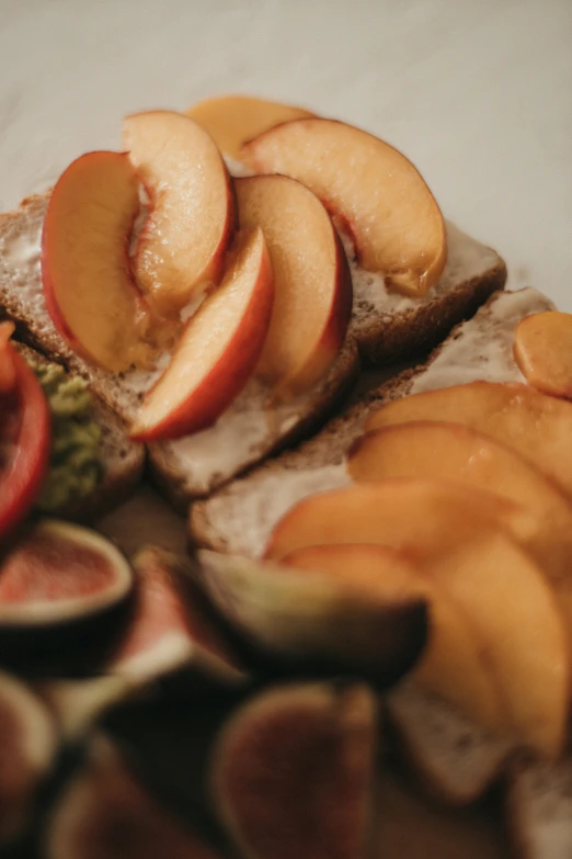 sliced peaches and slices of banana on bread