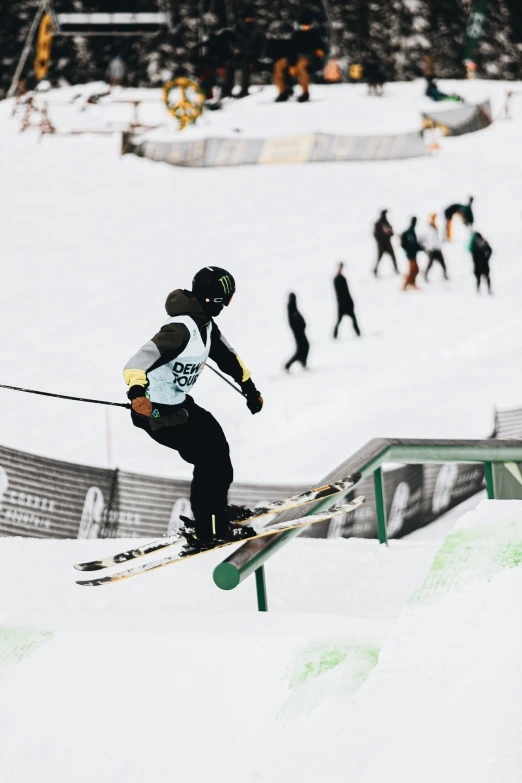 a person skiing on some rail in the snow