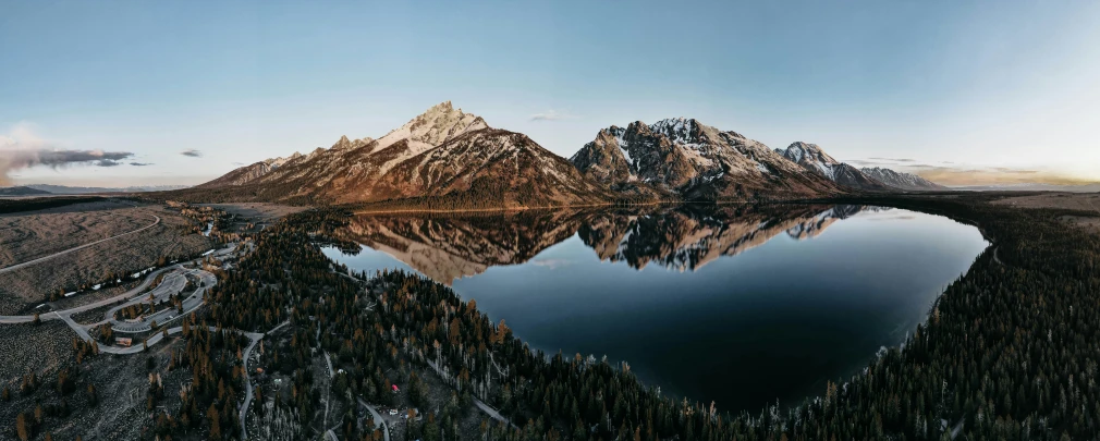 a picture of a large body of water surrounded by mountains