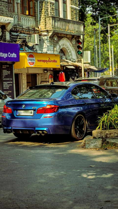 cars are parked near each other on a street