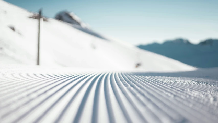 a snowy slope that looks like it has some tracks in the snow