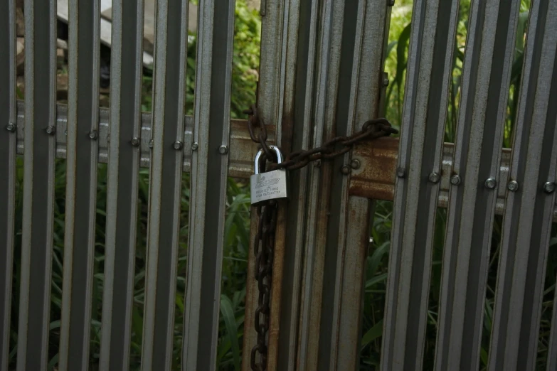 an image of a closed gate with a padlock on it