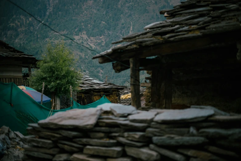 an image of a group of tents set up in the wilderness