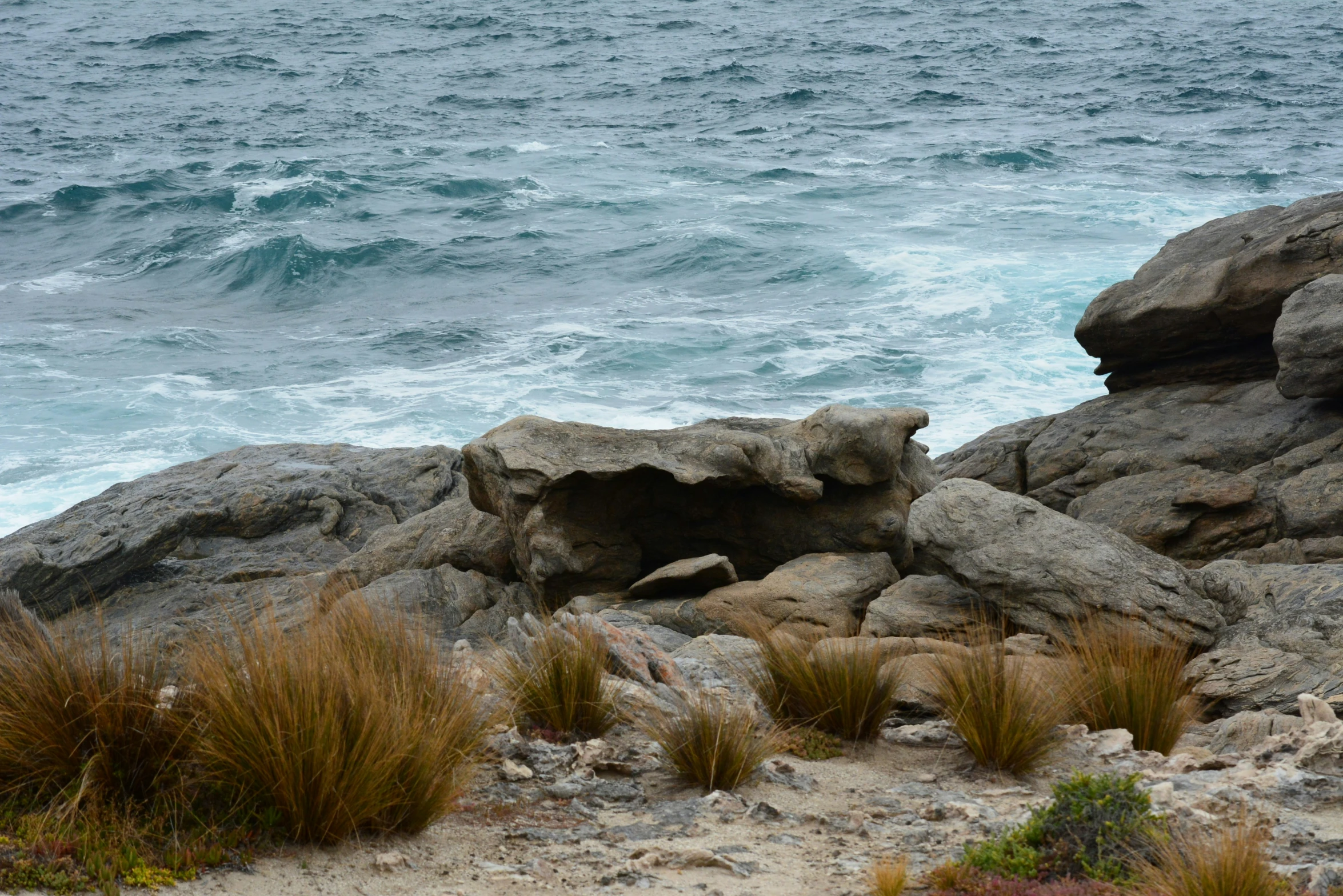 the ocean on an island with rocky shore