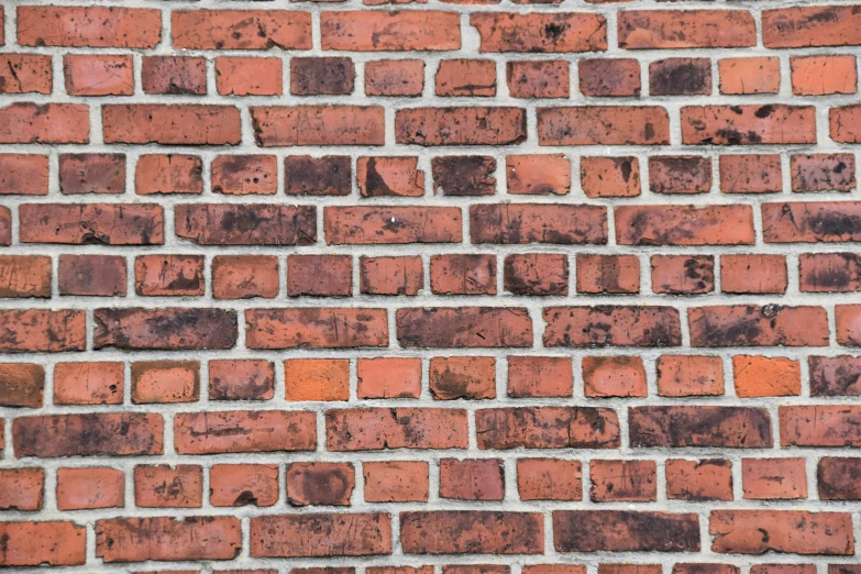 a close up of the texture of an old brick wall