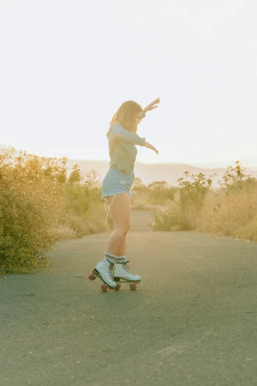 a woman is riding on top of a skateboard