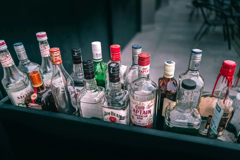 a cabinet full of alcohol bottles and liquor bottles