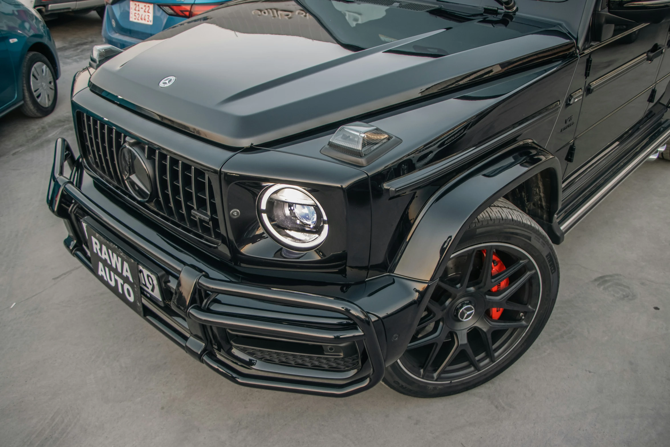 an armored black car with red ke pads