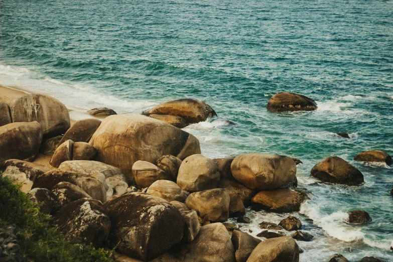 the water next to the shore has waves coming up