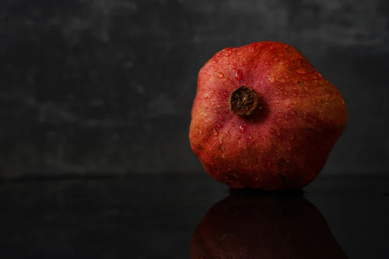 an apple with brown spot in it sitting on a table