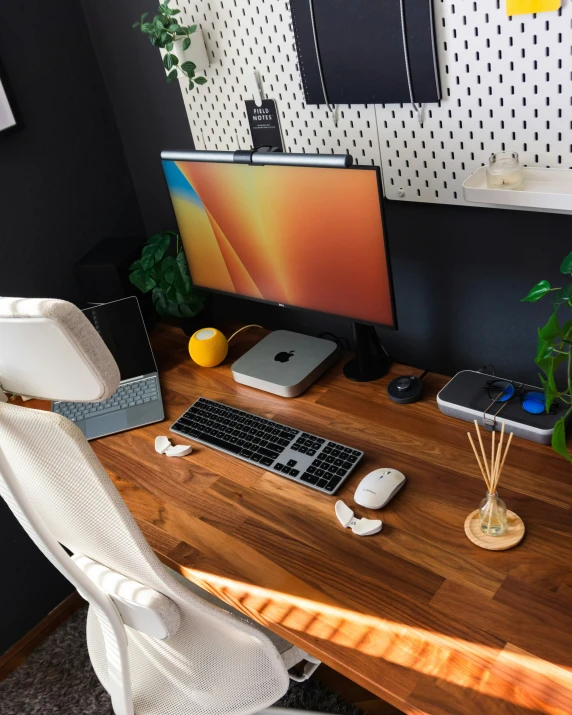 there is a computer monitor and keyboard on this desk