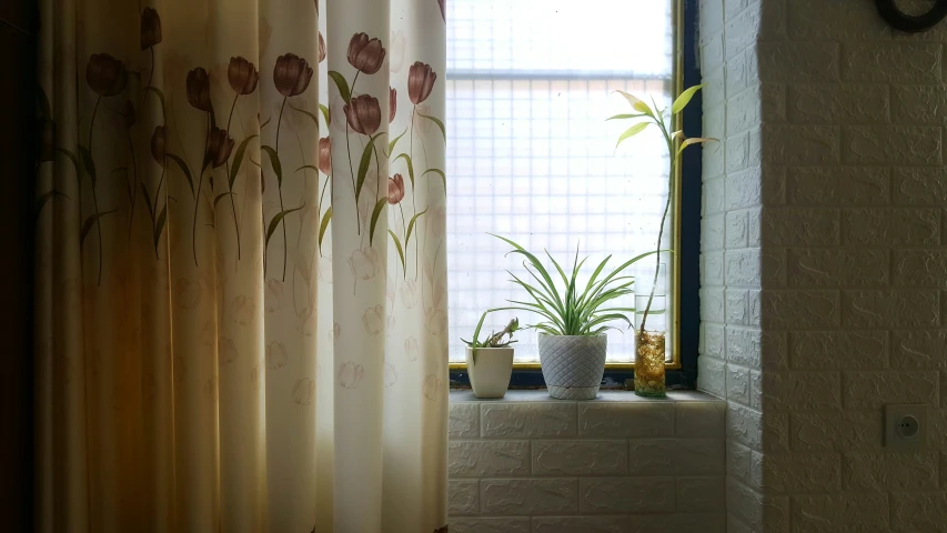 a bathroom with flower curtains and other decorations