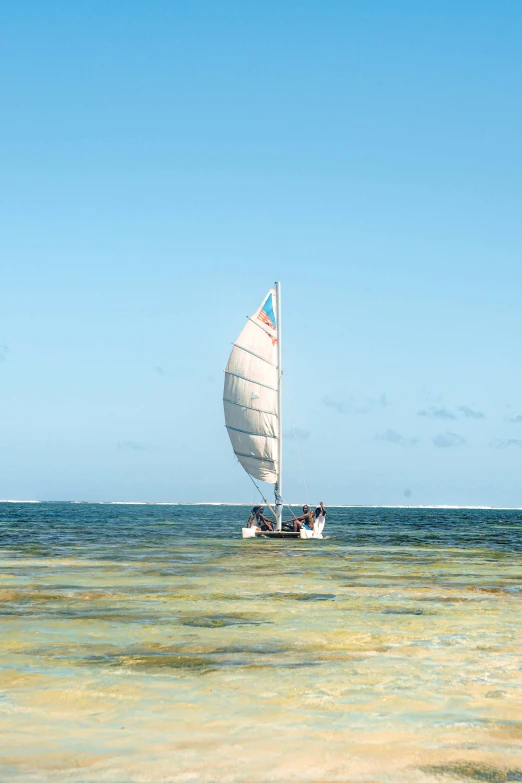 a white boat in blue water during the day