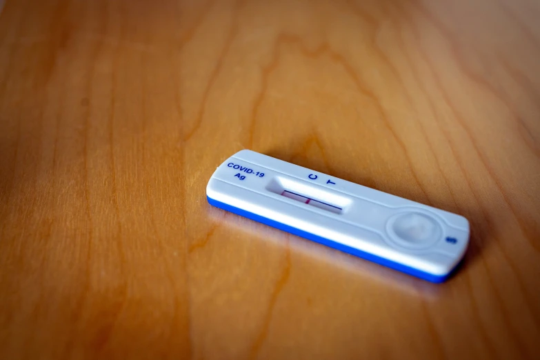 a wii remote that has been placed on a table