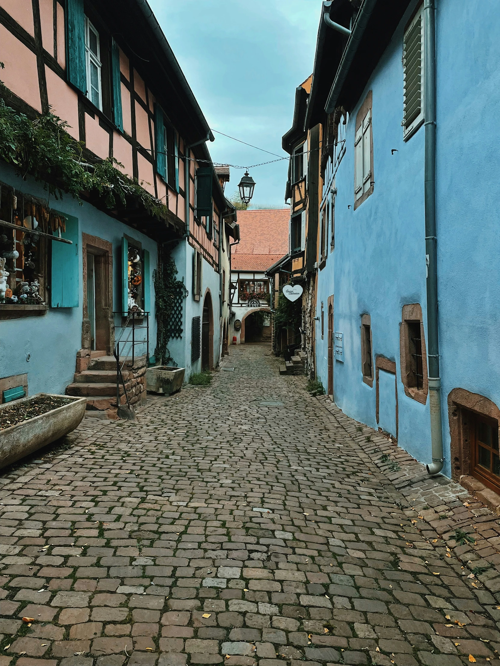 an old city street is paved and empty