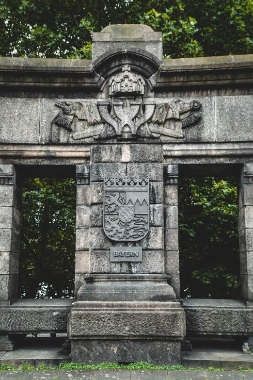 a stone monument with an arch over it