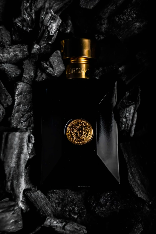 the top side of an ornate bottle in the dark