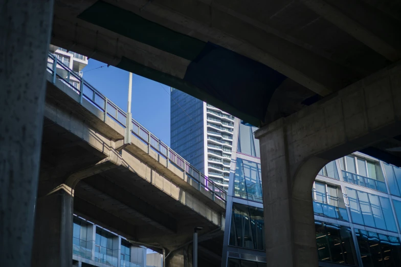 an overpass with a view of skyscrs in the background