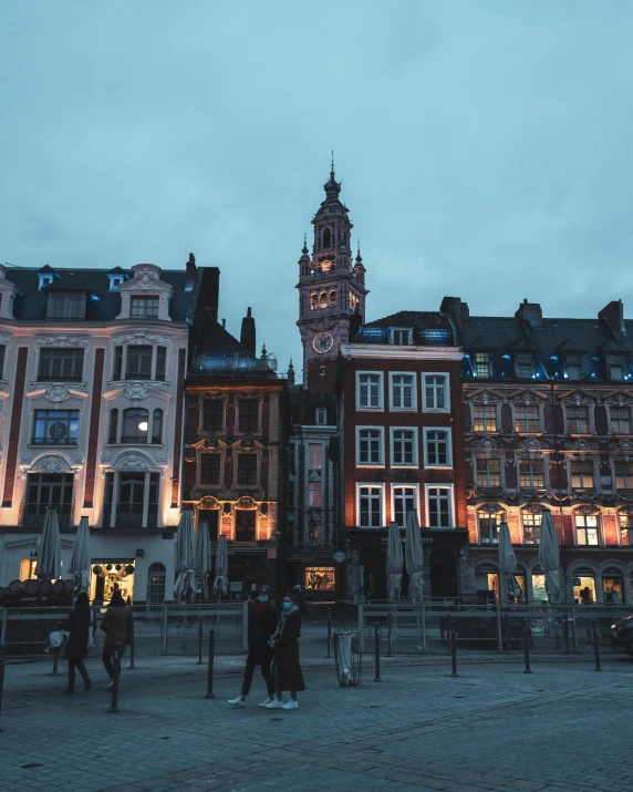 a street corner with various buildings lit up