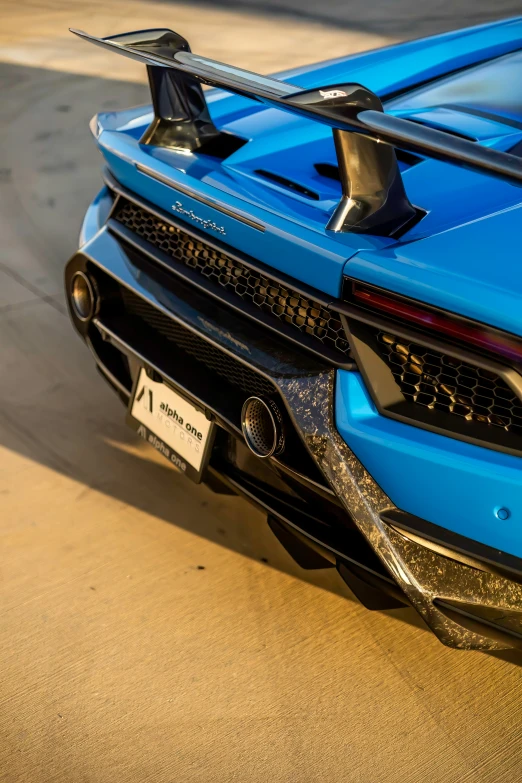 the back end of a blue sports car