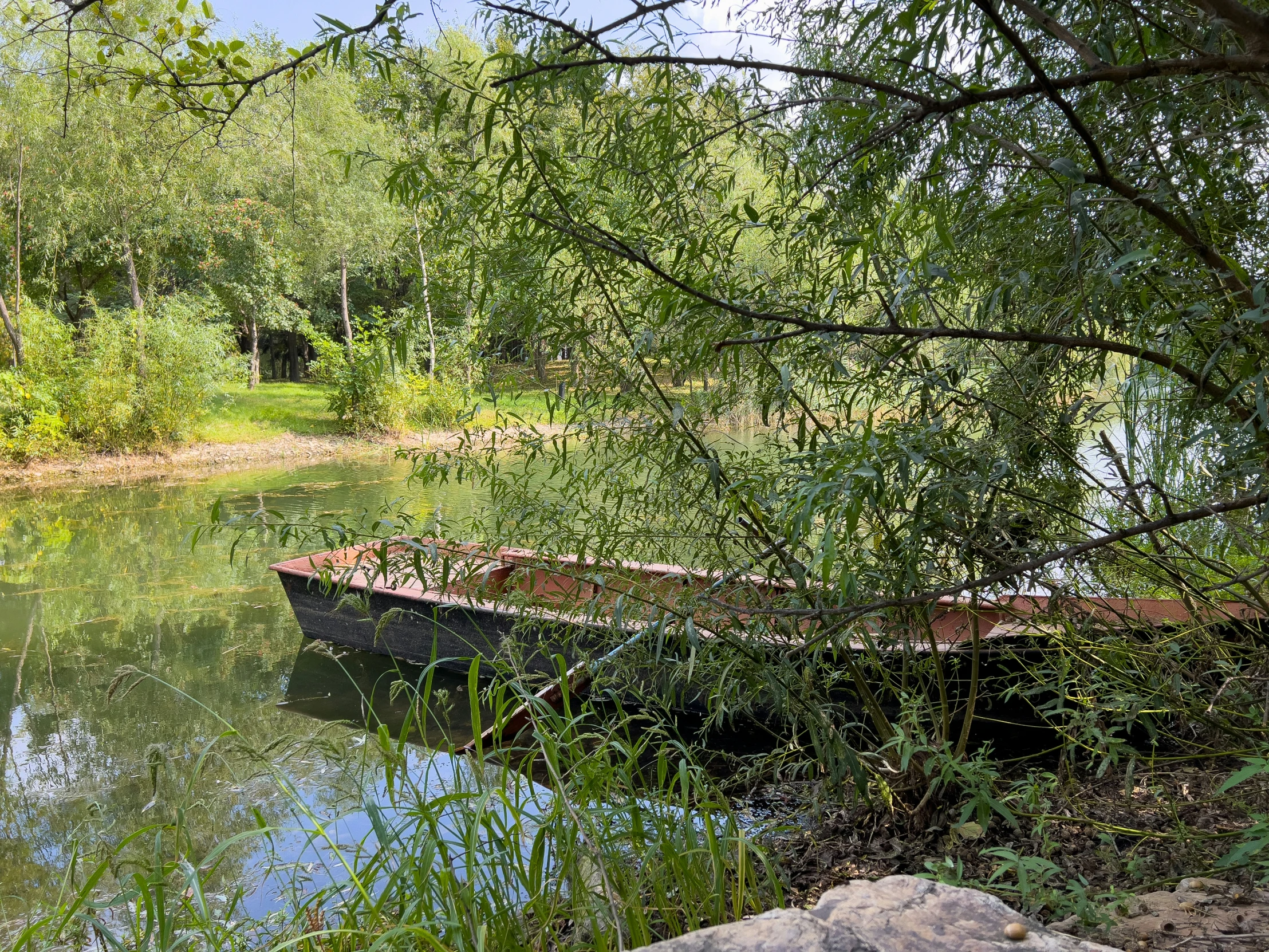 a boat is sitting alone in the water