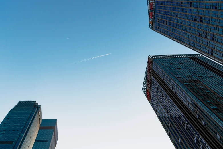 view of skyscrs from ground looking up to the sky