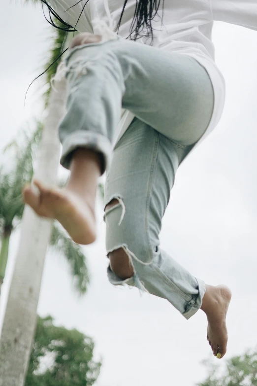 a girl jumping in the air on her skateboard