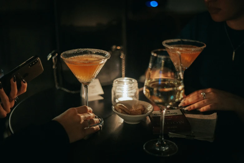 people at a table with drinks on the side