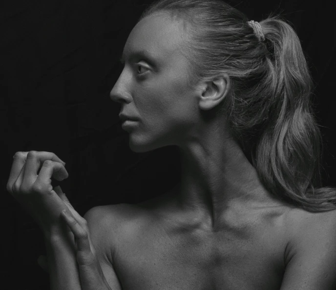 an image of a woman posing with her hair up