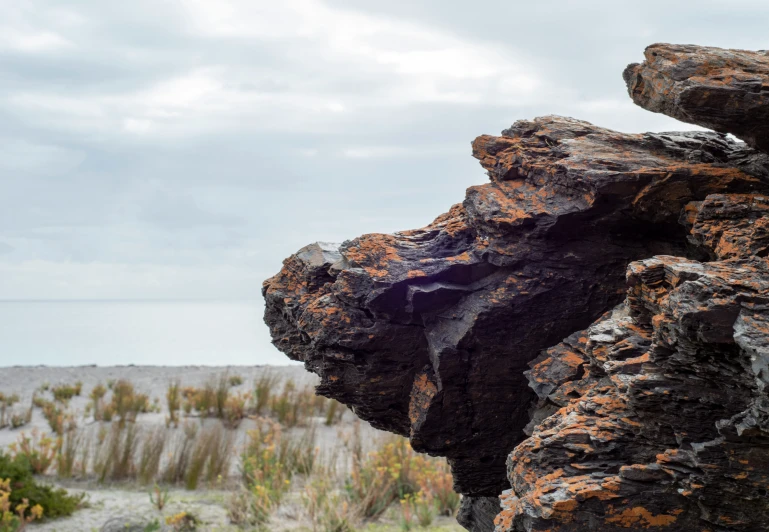 two large rocks are sticking out of one another