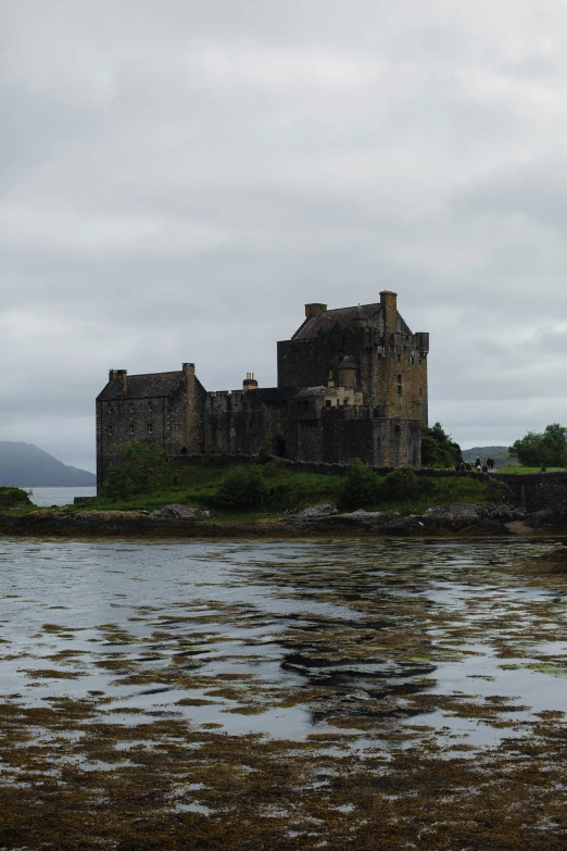 the water is calm and has low houses