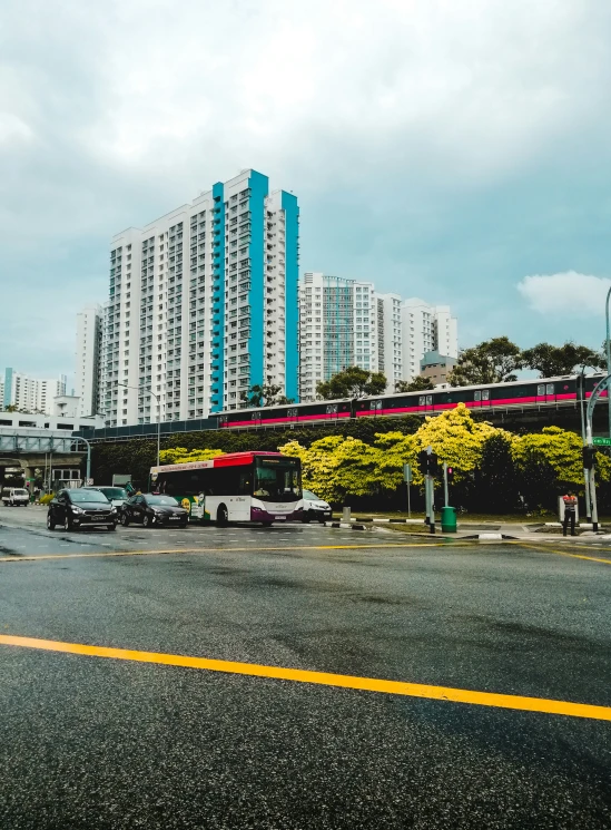 tall buildings stand along a city street in the afternoon