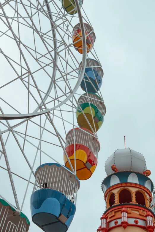 many colorful balls are attached to a ferris wheel