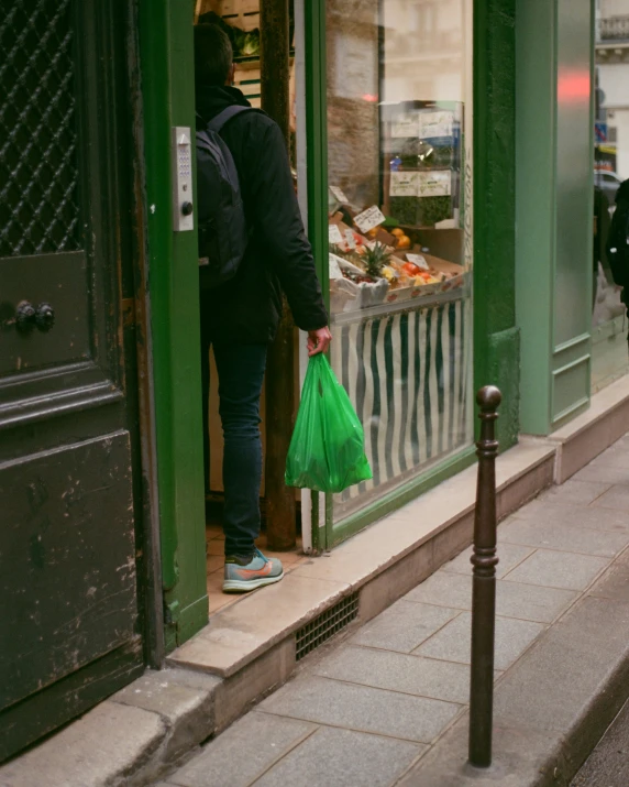 there is a person getting ready to open a store