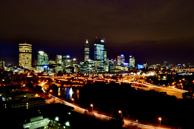 an image of a night scene with lights on the streets