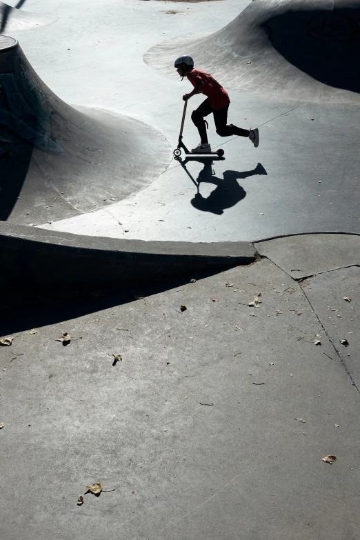 the boy is skateboarding around a half pipe