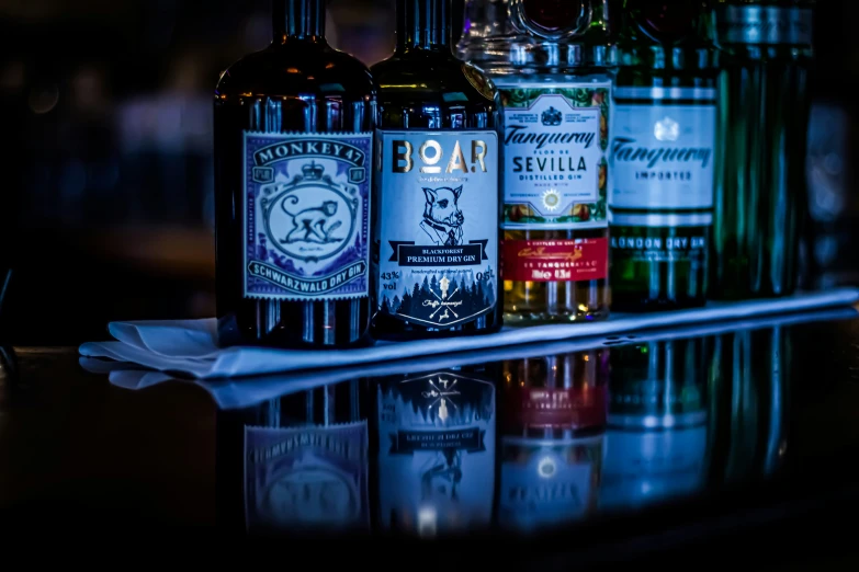 bottles of various types of alcohol sitting on the counter