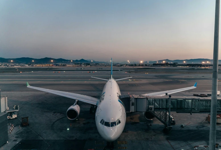 a large air plane sits on the runway