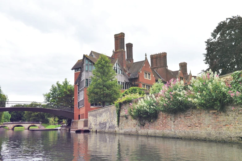 a brick wall is shown with trees and buildings