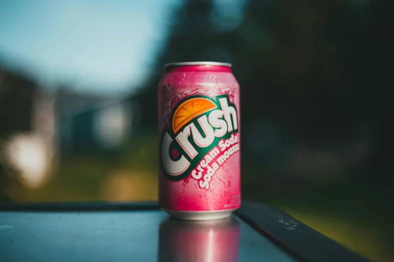 a can of crush fruit beverage on a table